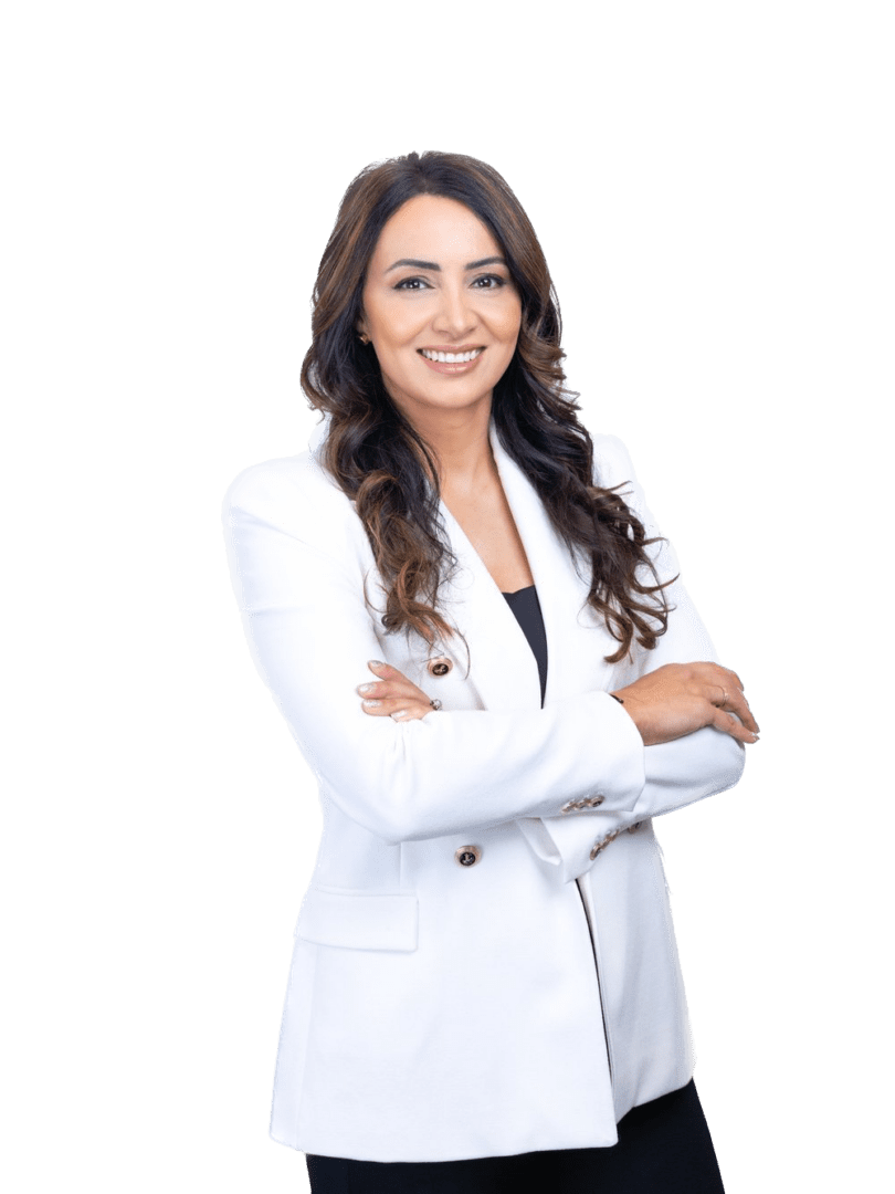 Dr Linda Khoshaba in a white blazer smiling on a transparent background